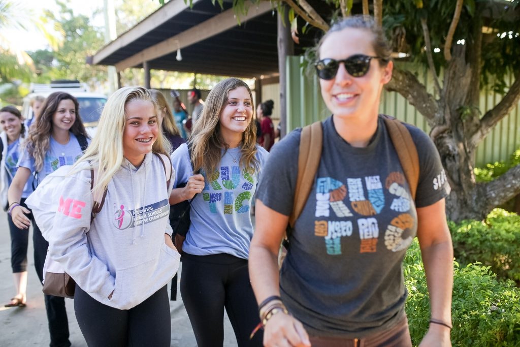 Young Rustic Pathways students traveling with a program leader.
