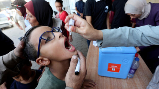 A child is vaccinated against polio during the second round of a vaccination campaign in Deir al-Balah, Gaza on October 14, 2024. 