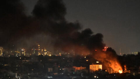 Smoke and flames rise from areas targeted by an Israeli airstrike in Beirut's southern suburbs late on October 20, 2024.