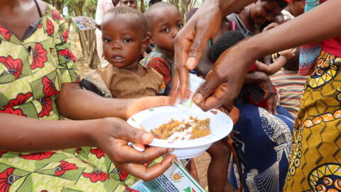 20 September, Gitega Women using multiple micronutrient powders during a nutritional education session