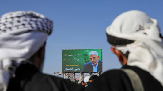 Protesters gather in front of a billboard of late Hamas leader Yahya Sinwar in Sanaa, Yemen on October 18, 2024.