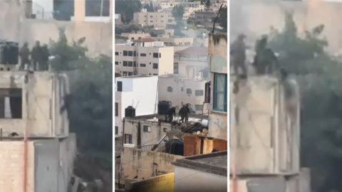 These are screengrabs of videos showing Israeli soldiers throwing the bodies of dead Palestinians off of the top of a building in Qabatiya, Jenin, in the West Bank.