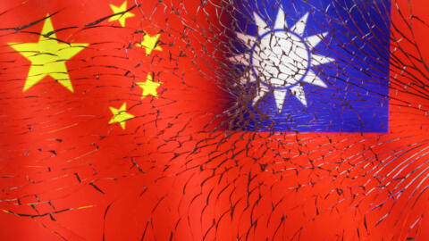 Chinese and Taiwanese flags are seen through broken glass in this illustration taken, April 11, 2023.