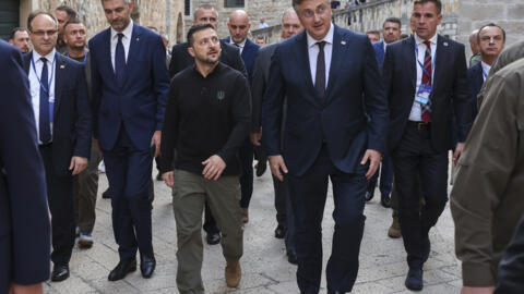 Ukrainian President Volodomyr Zelenskyy, center left, walks through the old town with Dubrovnik Mayor Mato Frankovic, left, and Croatian Prime Minister Andrej Plenkovic during pause of the Southeast E