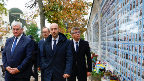 French Minister for Europe and Foreign Affairs Jean-Noël Barrot (R) and Ukrainian Foreign Minister Andrii Sybiha visit the Memory Wall of Fallen Defenders of Ukraine outside Saint Michael's Cathedral, amid Russia's attack on Ukraine, in Kyiv, Ukraine 19 October 2024. 