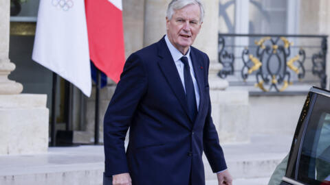 France's Prime Minister Michel Barnier leaves after the weekly cabinet meeting at the presidential Elysee Palace in Paris, on October 1, 2024. (Photo by Ludovic MARIN / AFP)