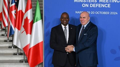 Italy's Defense Minister Guido Crosetto (R) and US Secretary of Defense Lloyd Austin shake hands during the welcome ceremony of the Group of Seven (G7) Defence Ministers Summit at the Palazzo Reale in Naples, Italy, on 19 October 2024.