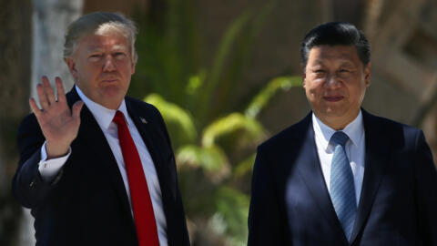 U.S. President Donald Trump waves as he and China's President Xi Jinping walk along the front patio of the Mar-a-Lago estate after a bilateral meeting in Palm Beach, Florida, U.S., April 7, 2017.