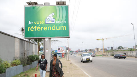 An electoral poster for an upcoming constitutional referendum, as seen in Libreville on 29 August 2024. 