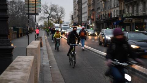 Cyclists on a dedicated pathway in Paris, 2019.
