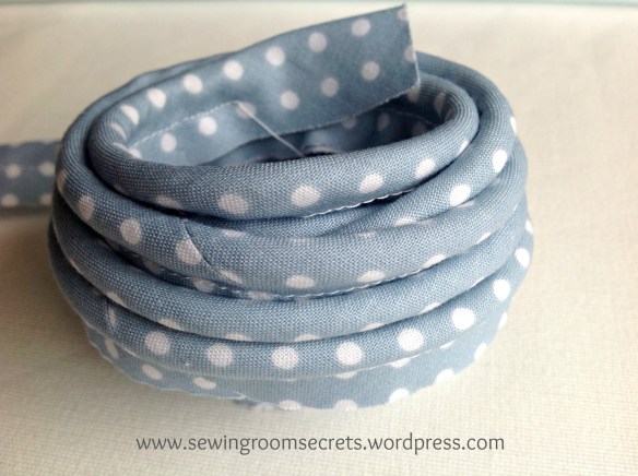 Piping cord covered in continuous bias binding