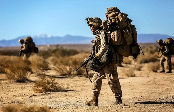 Army Ranger with heavy rucksack