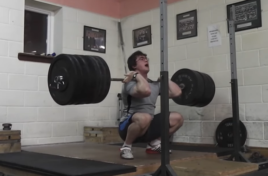 Athlete front squatting