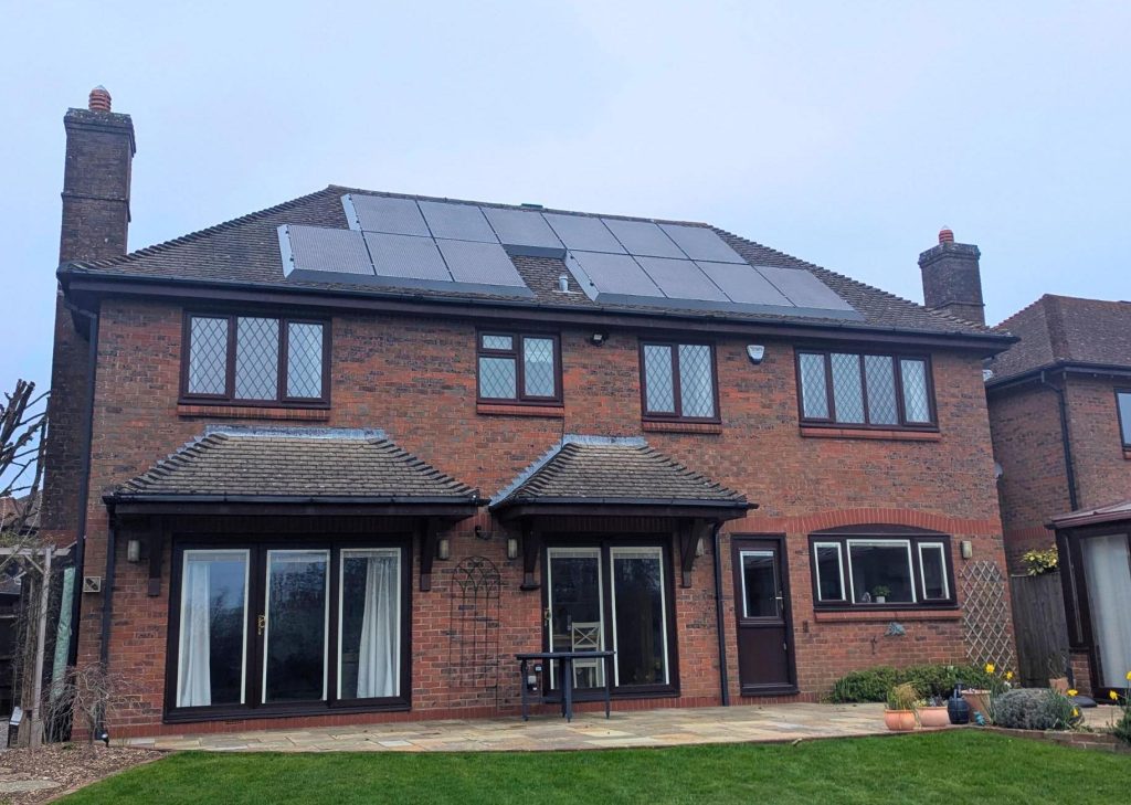 A red brick house with solar panels with SolaSkirt installed.