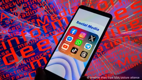 Social media app icons displayed on a smartphone with a word cloud visible in the background 