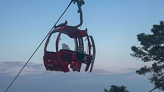 A severely damaged cabin of a cable car transportation system is seen outside Antalya, southern Turkey, Friday, April 12, 2024.