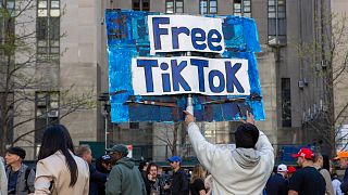 FILE - A man carries a Free TikTok sign in front of the courthouse where the hush-money trial of Donald Trump was underway on April 15, 2024, in New York.