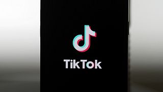 A TikTok logo is shown on a phone in San Francisco, Friday, January 17, 2025.