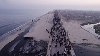 Tens of thousands return to devastated northern Gaza as Israel lifts its closure under truce deal.