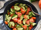 Why should you avoid mixing Tomato and Cucumber in salads?