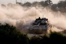 An Israeli tank maneuvering near the Israel-Gaza border this week. The war has expanded to include Iran and its proxies.