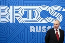 A photograph provided by Russian state media showed President Vladimir V. Putin of Russia looking on from the sidelines of a BRICS forum in Saint Petersburg in July.