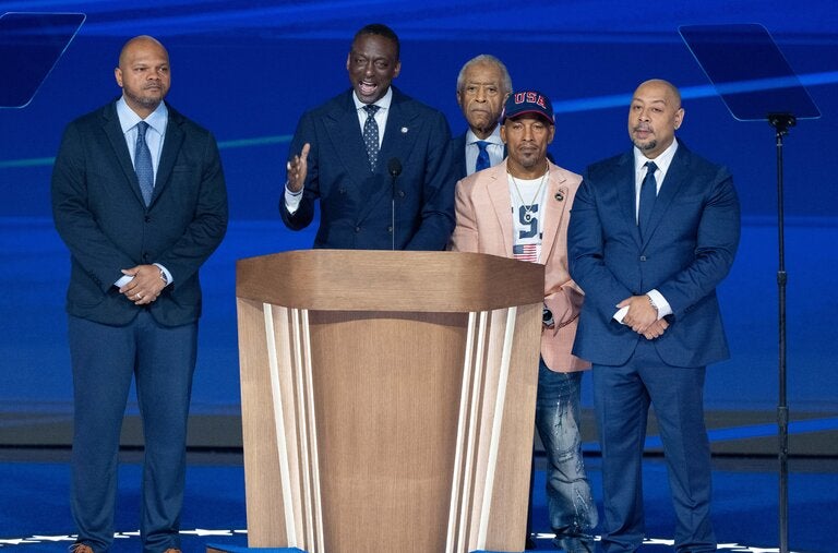 Kevin Richardson, Yusef Salaam, Korey Wise and Raymond Santana, who, with Antron McCray, are now known as the Exonerated Five, spoke at the Democratic National Convention in August. Al Sharpton is visible behind them.