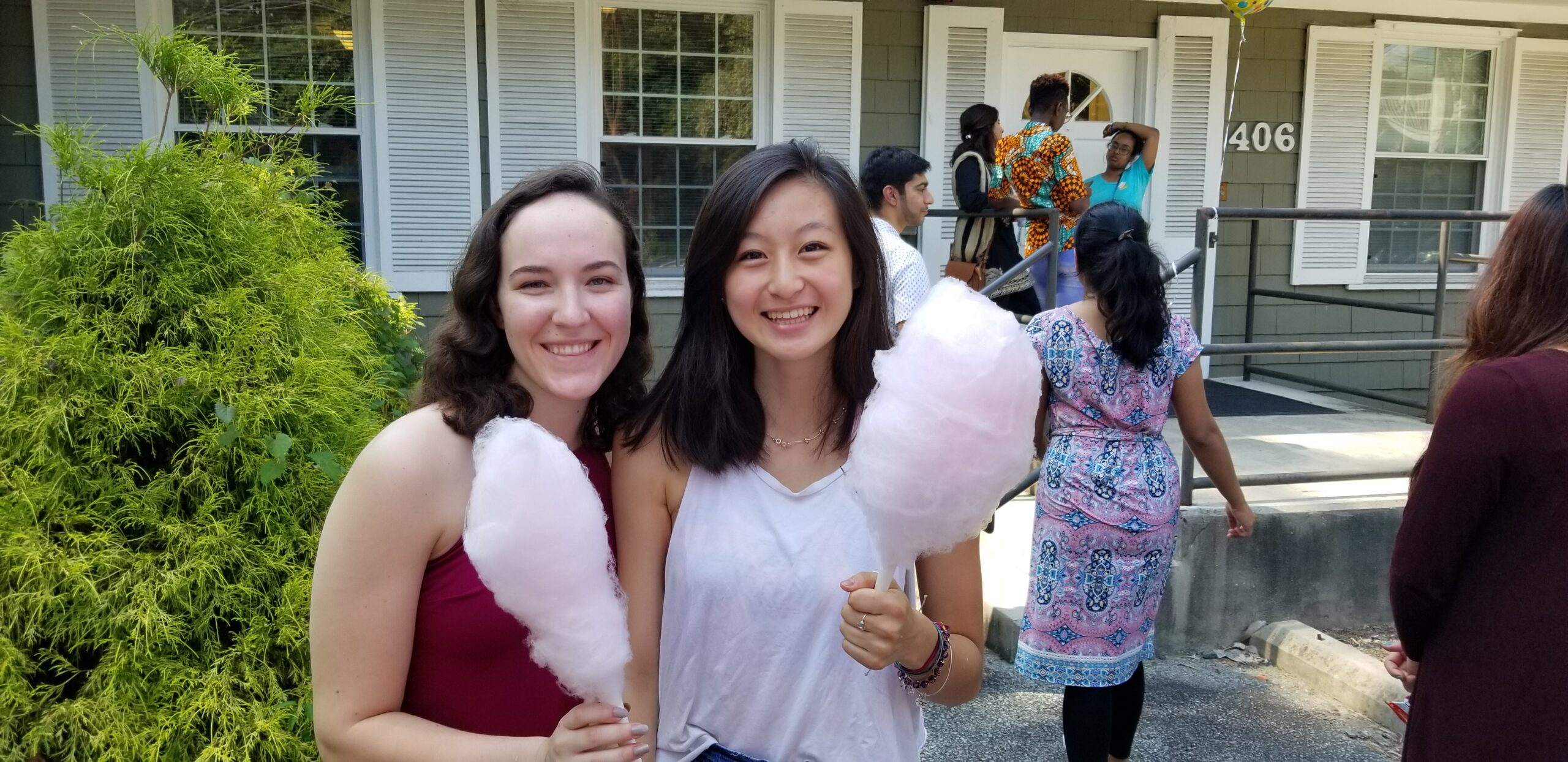 two students holding cotton candy