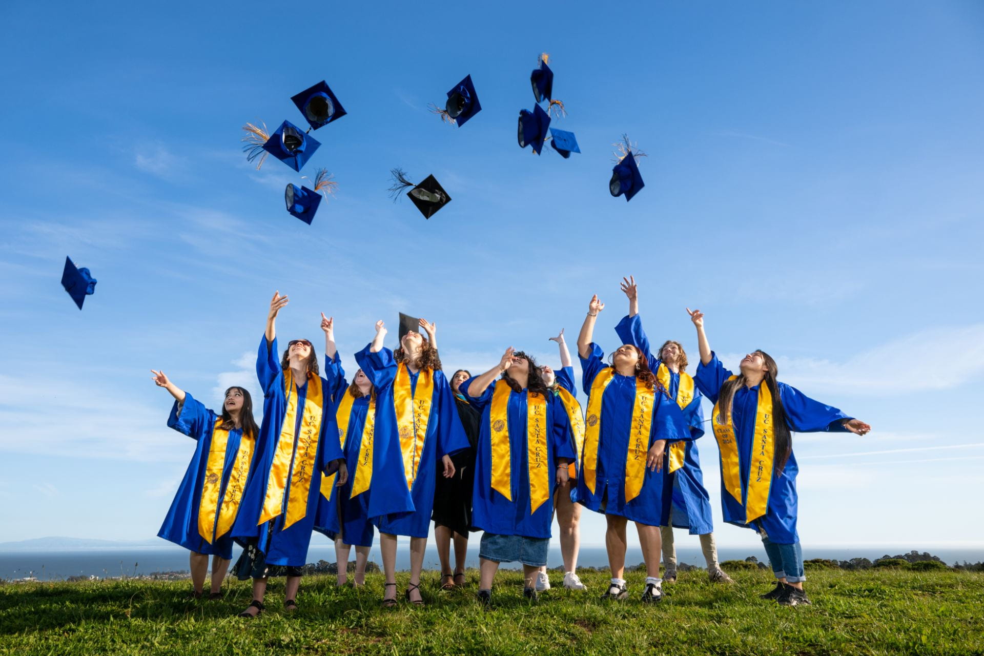 Students throwing their graduation caps in the air