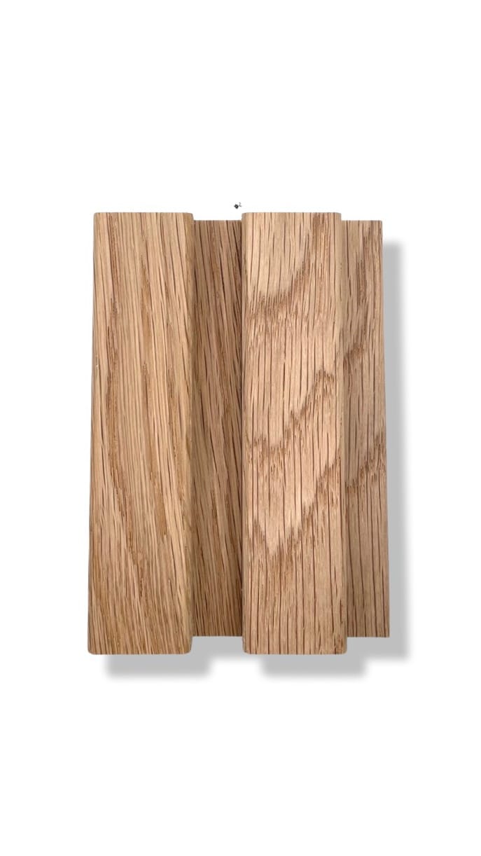 Flexible wood tambour panels in light brown with pronounced grain, showcased side by side on a white background with subtle shadow. | Custom tambour and architectural wood specialists