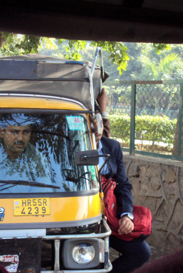All dressed in suit but traveling by Auto - Unique combination