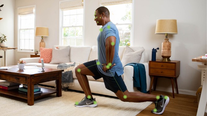 man doing lunges in his living room