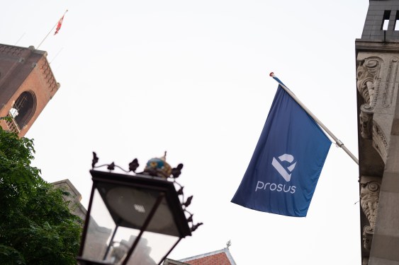 A Prosus flag is displayed ahead of the trading debut of the new Prosus NV unit of Naspers Ltd., outside the Amsterdam Stock Exchange.