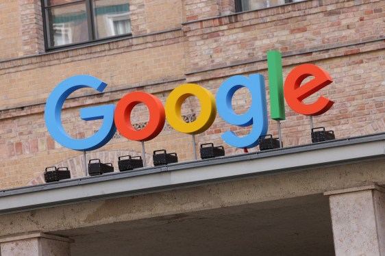 Google corporate logo hangs outside the Google Germany offices