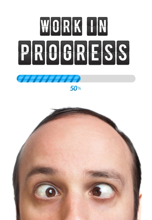 Young man with Work in progress mark over his head