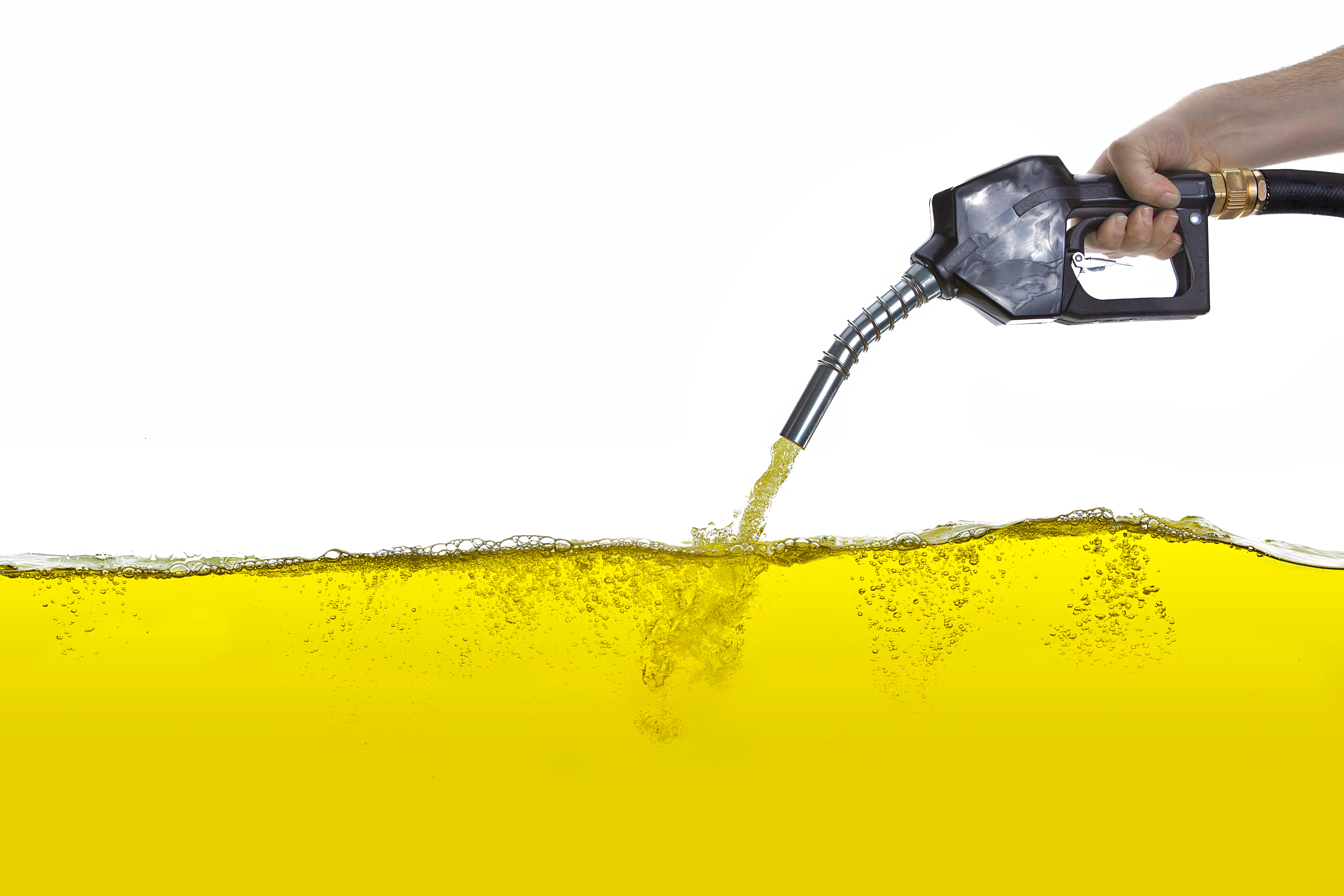 petrol pump nozzle hold by hand with gasoline