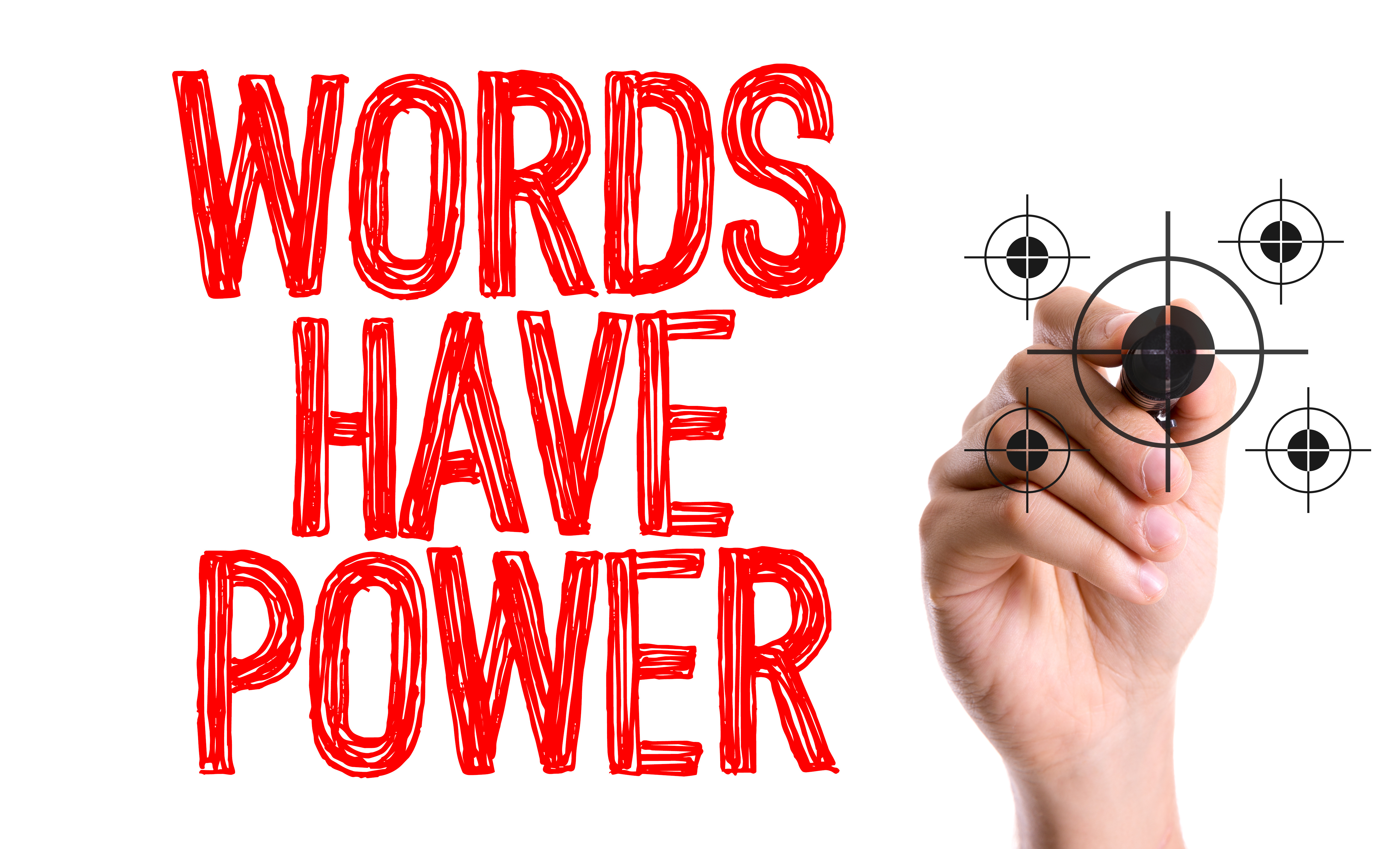 Hand with marker writing: Words Have Power