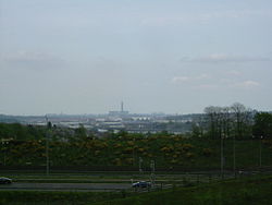 In sight are the M2, Rochester Bridge and Castle, the covered slips at Chatham Dockyard, Kingsnorth Power station and in the far distance the Grain Power Stations