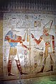 Wepwawet giving scepters to Seti I, bas-relief from the Temple of Seti I. Nearby hieroglyphs and elements which are usually painted black also appear grey.