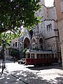 Tram 21 near Sóller Mercat stop, passing close to the church of San Bartolomé