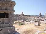 Ruins of buildings and of an amphitheatre.