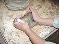 working with clay in a pottery