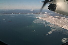 Aerial view, bay of Sept Îles, port[11] and city of Sept-Îles