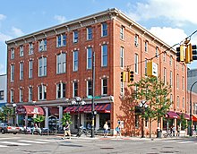 A photograph of the front and side facade of the Germania Building Complex