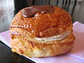 Fastelavnsbolle (Mardi Gras bun) filled with cream and topped with chocolate glaze.