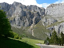 bare cliffs with meadow in the foreground