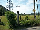 Colonne avec chapiteau corinthien surmonté d'une croix en fer