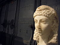 Possible sculpted head of Cleopatra VII wearing an Egyptian-style vulture headdress, discovered in Rome, either Roman or Hellenistic Egyptian art, Parian marble, 1st century BC, from the Capitoline Museums[439][440]