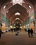 Covered arcade lined by shops.