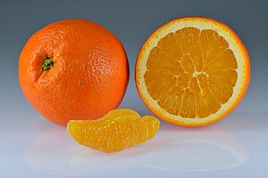 An orange whole and split